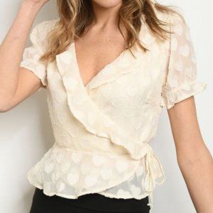 Short sleeve V-neck heart embossed ruffled blouse.